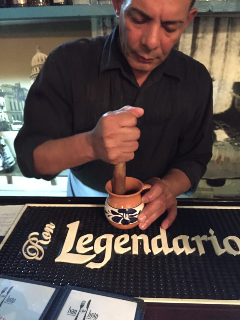 a man holding a cigar in a mug
