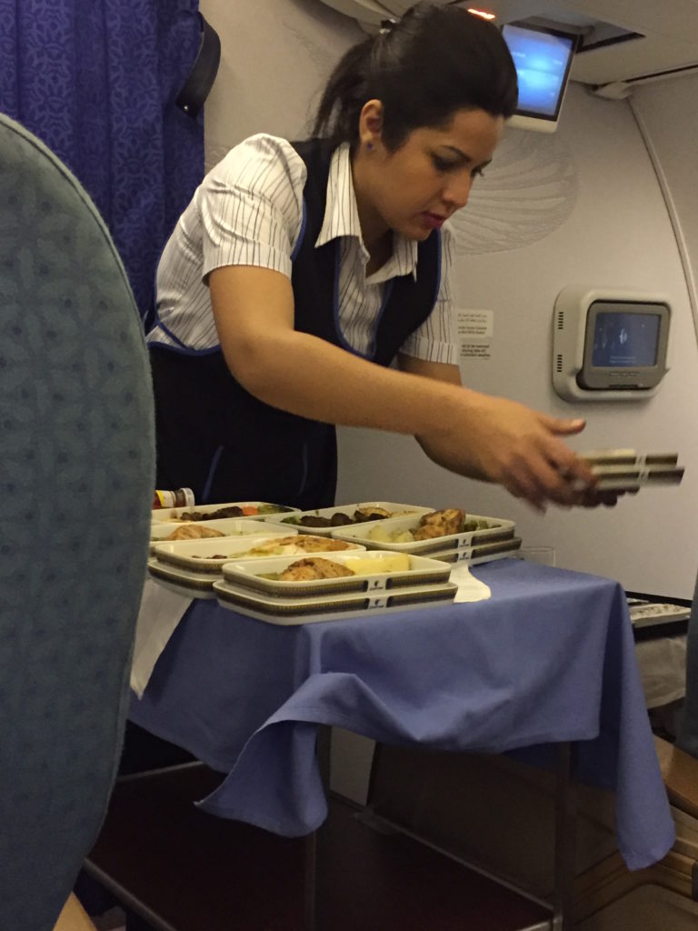 a woman serving food on a table