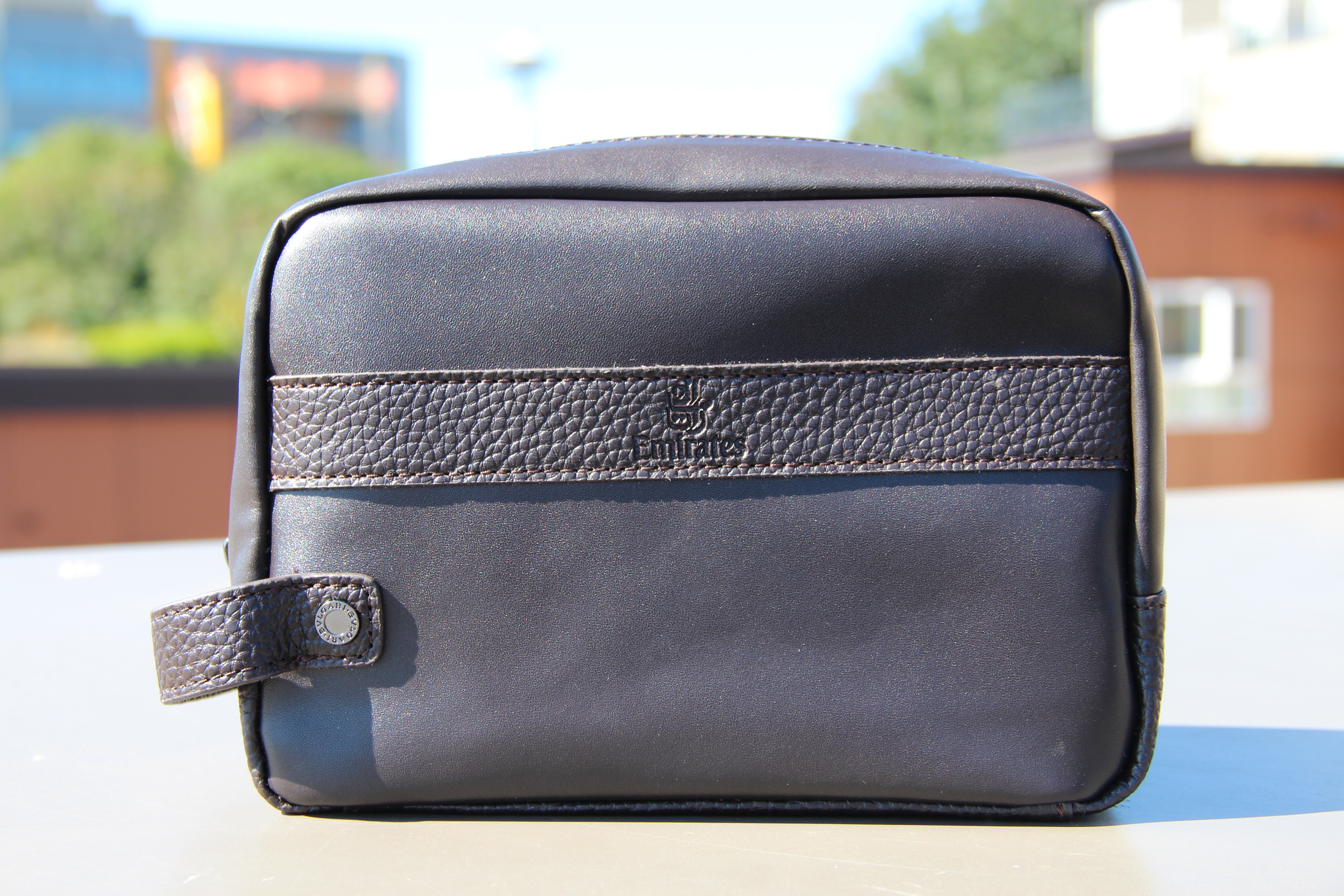 a black bag with a leather strap
