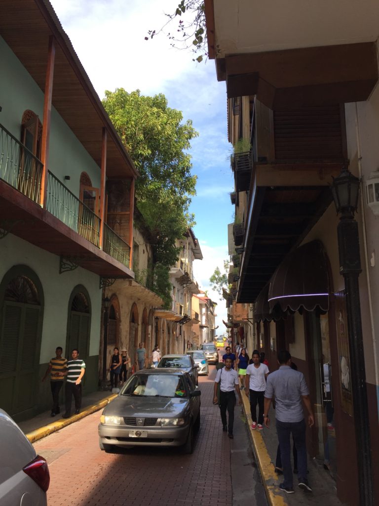 a group of people walking down a street