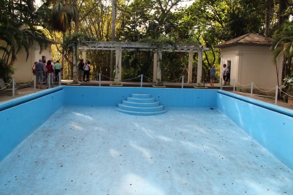 a pool with steps and people around it