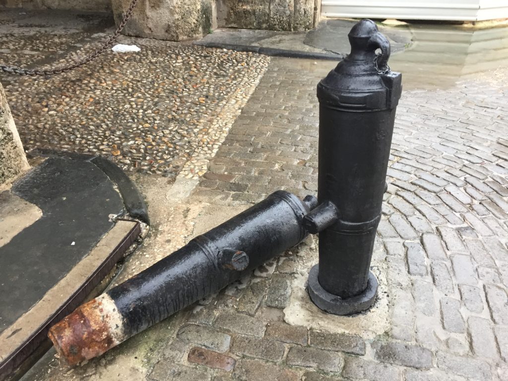 a black pipe on a brick surface