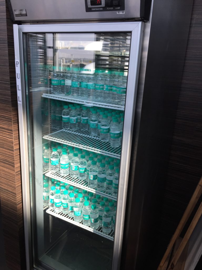 a refrigerator full of water bottles