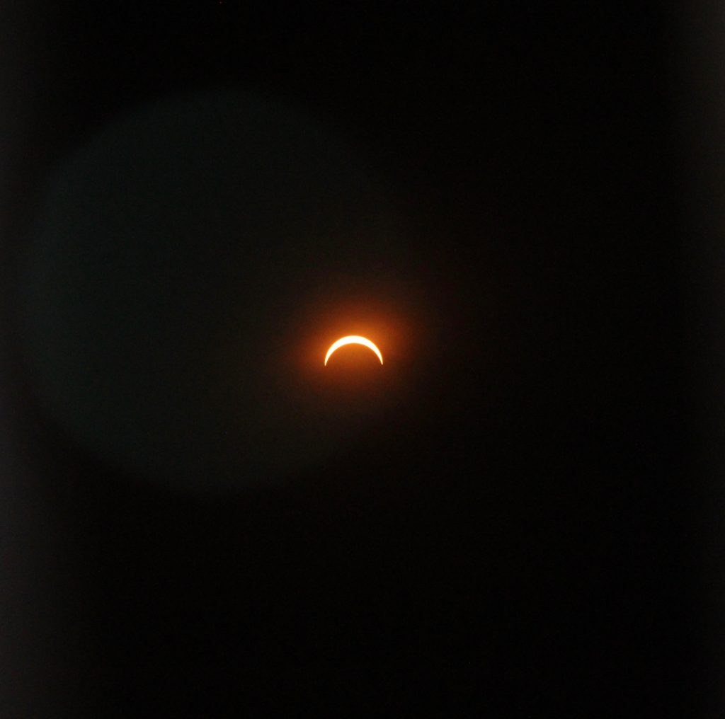a solar eclipse in the sky