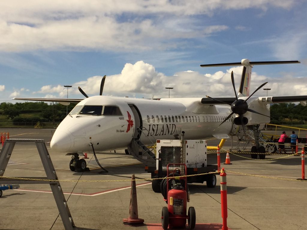 a white airplane on a runway