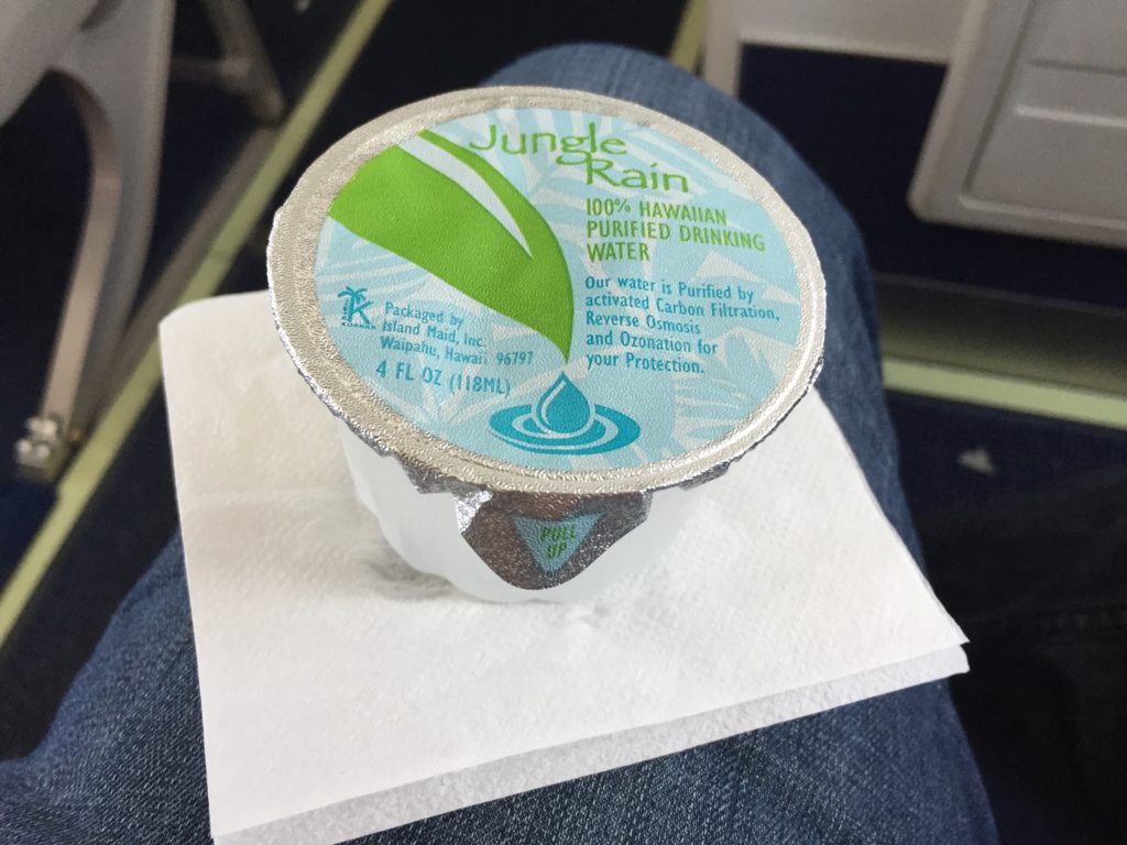 a small container of water on a napkin