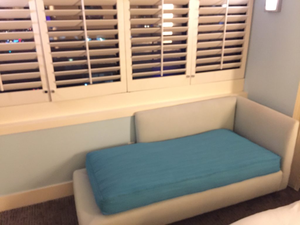 a couch in a room with blinds