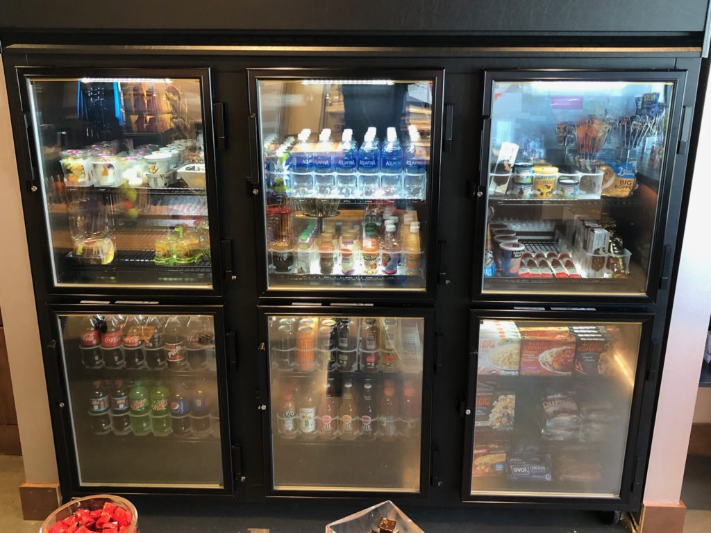 a display case with drinks and beverages
