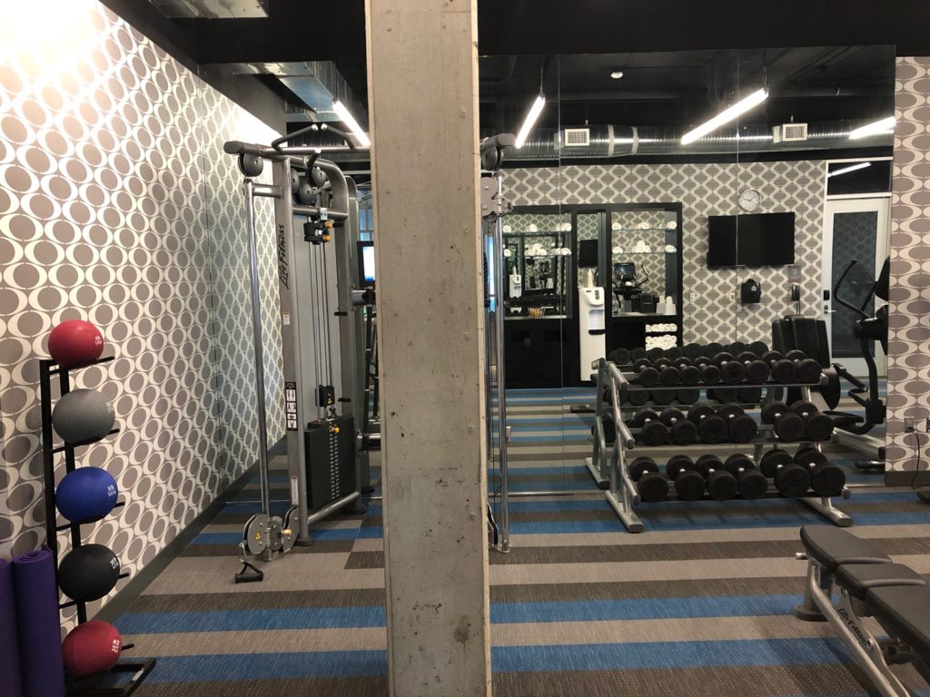 a gym with weights and equipment