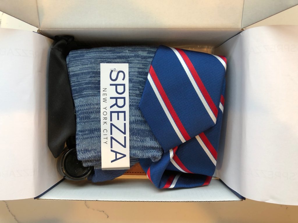 a box with a tie and socks