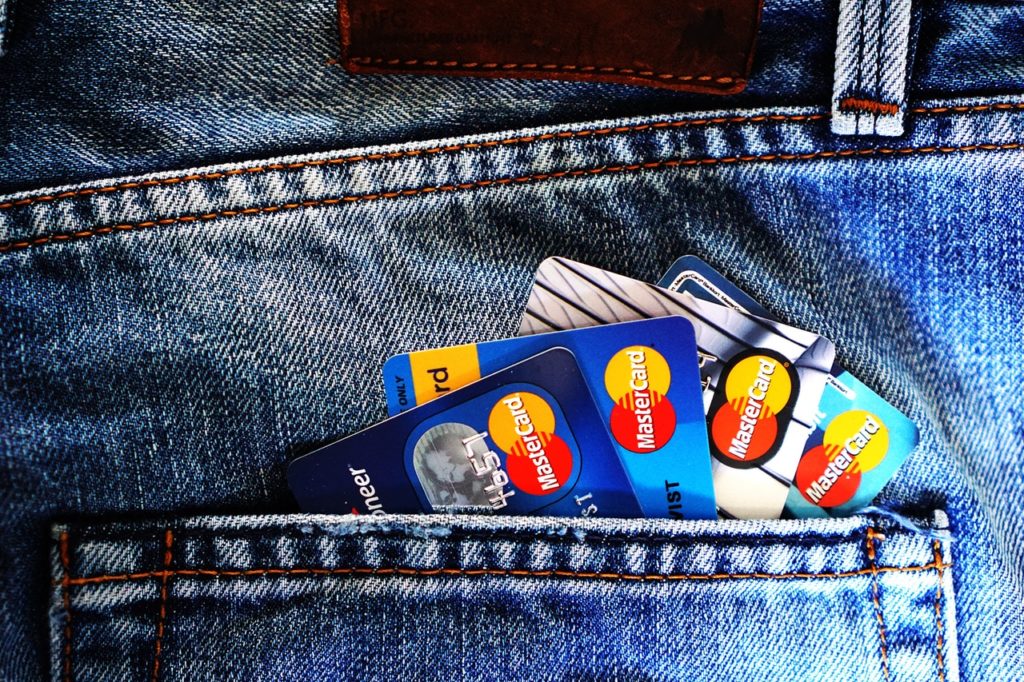 several credit cards in a pocket of jeans