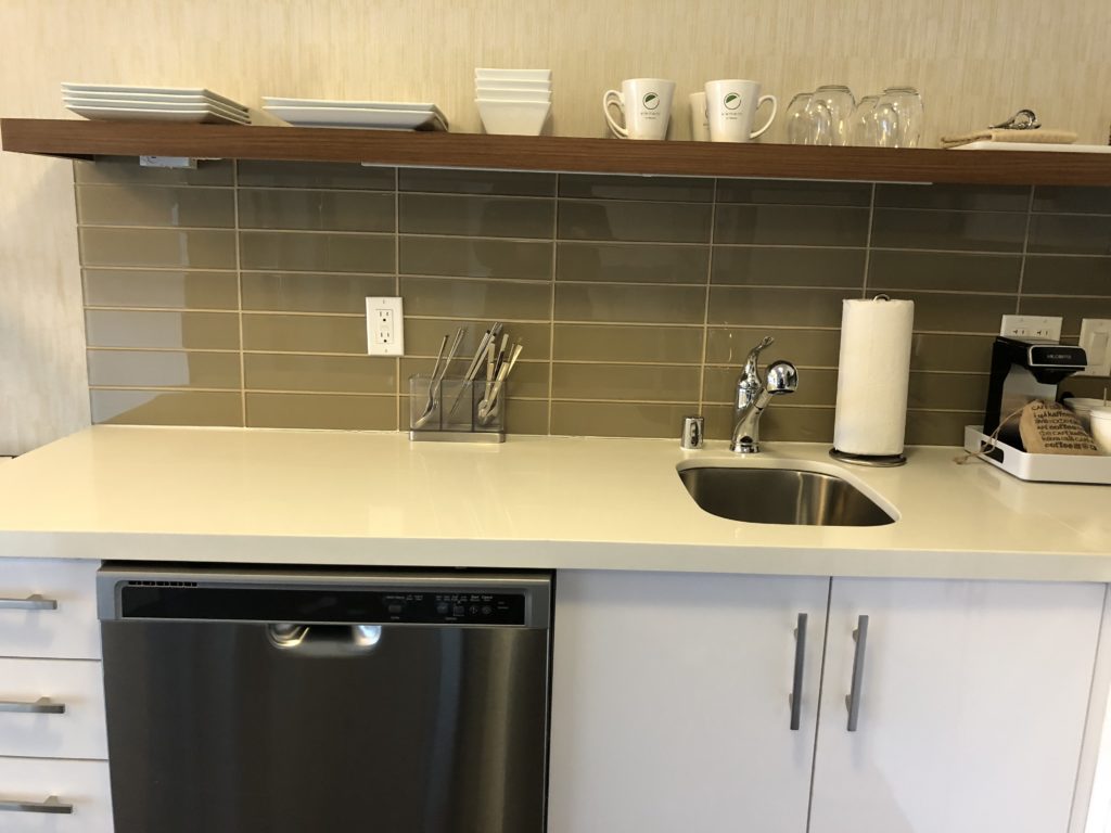 a kitchen with a sink and dishwasher