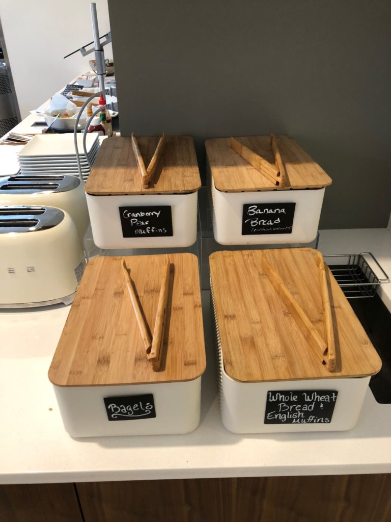 a group of containers with wooden lids