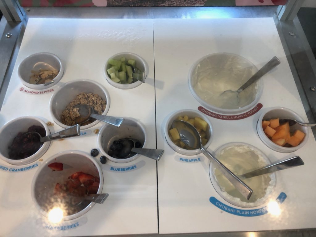 a group of bowls with different foods in them