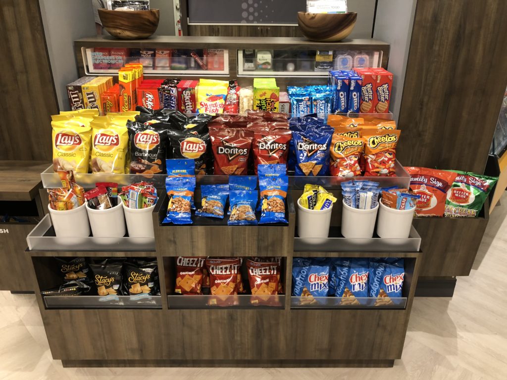 a shelf with different types of snacks