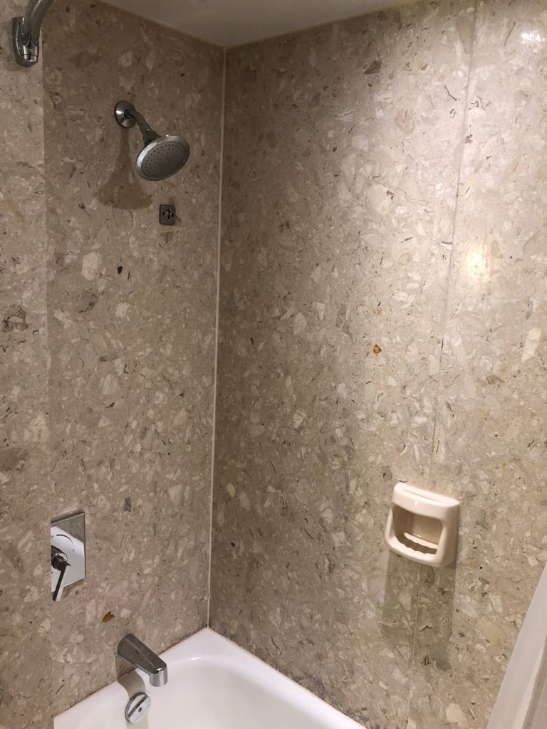 a shower head in a bathroom