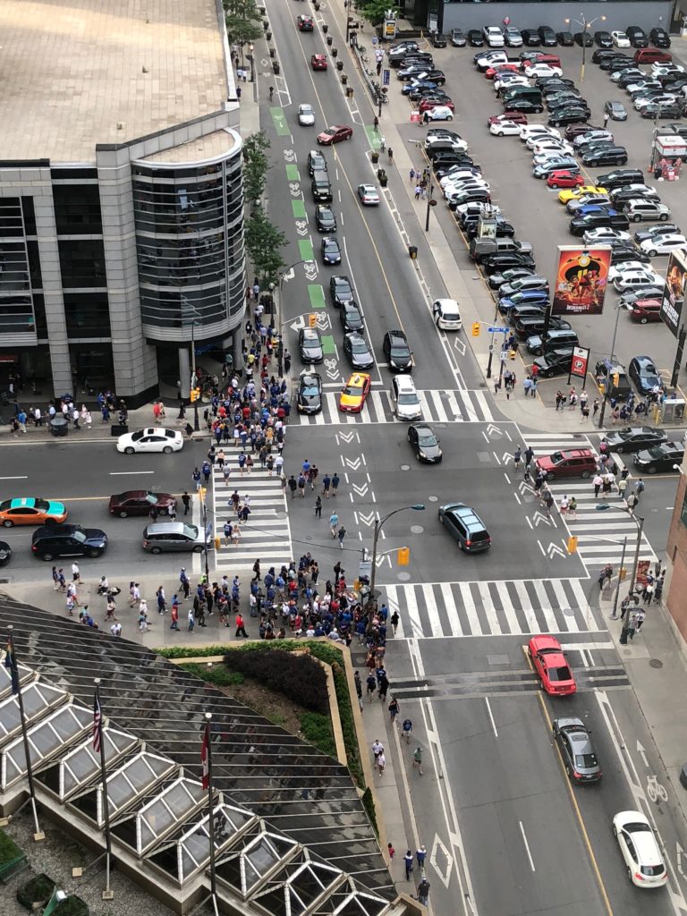 a group of people walking on a street