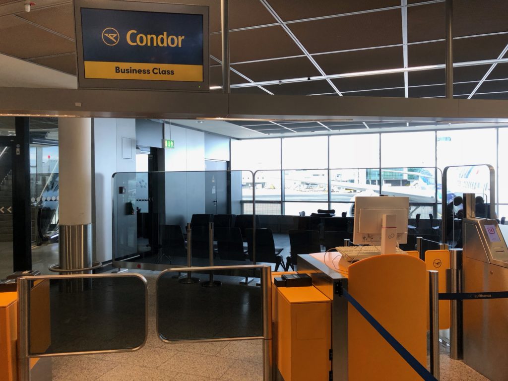 a yellow and black sign in an airport