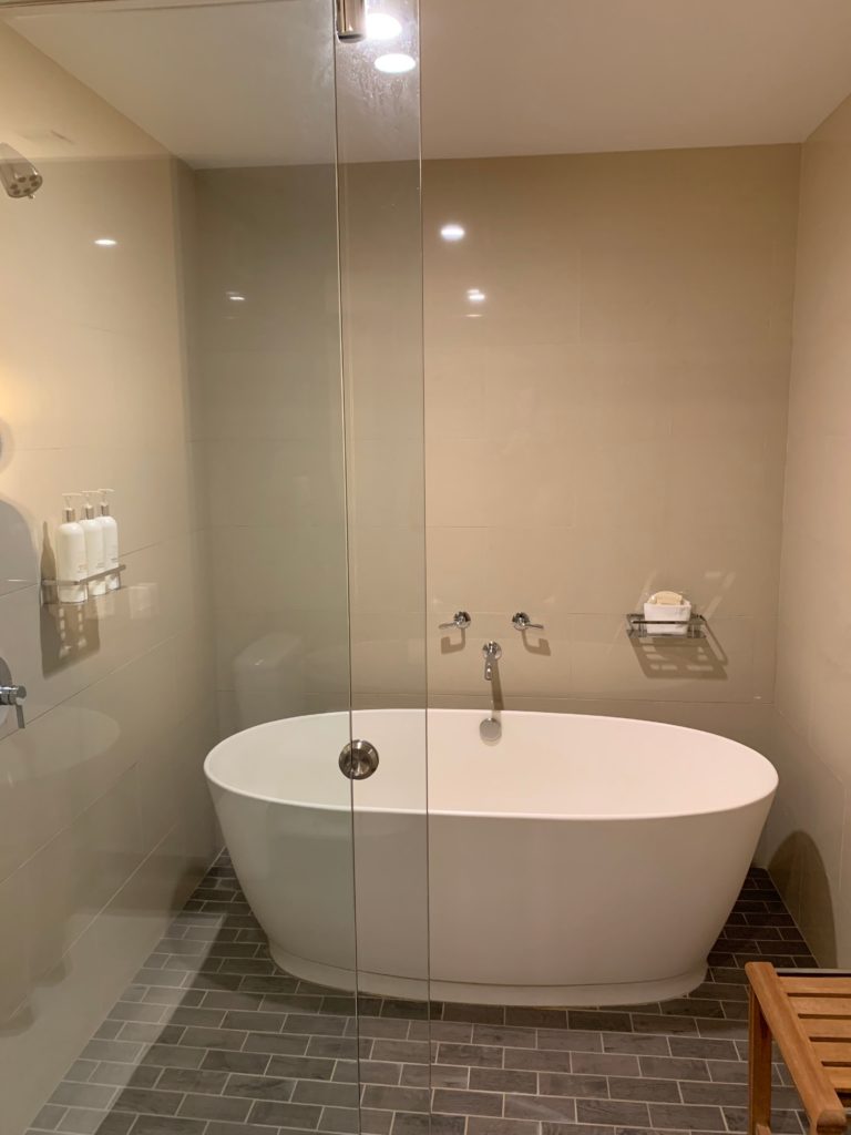 a bathroom with a glass shower door