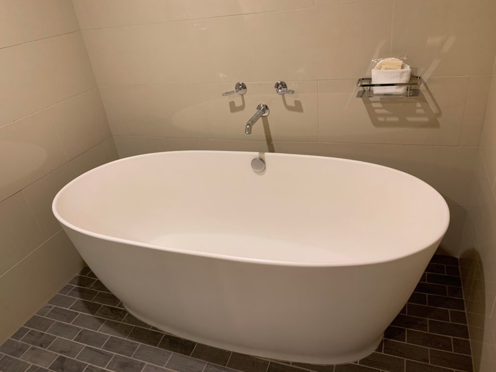 a white bathtub in a bathroom