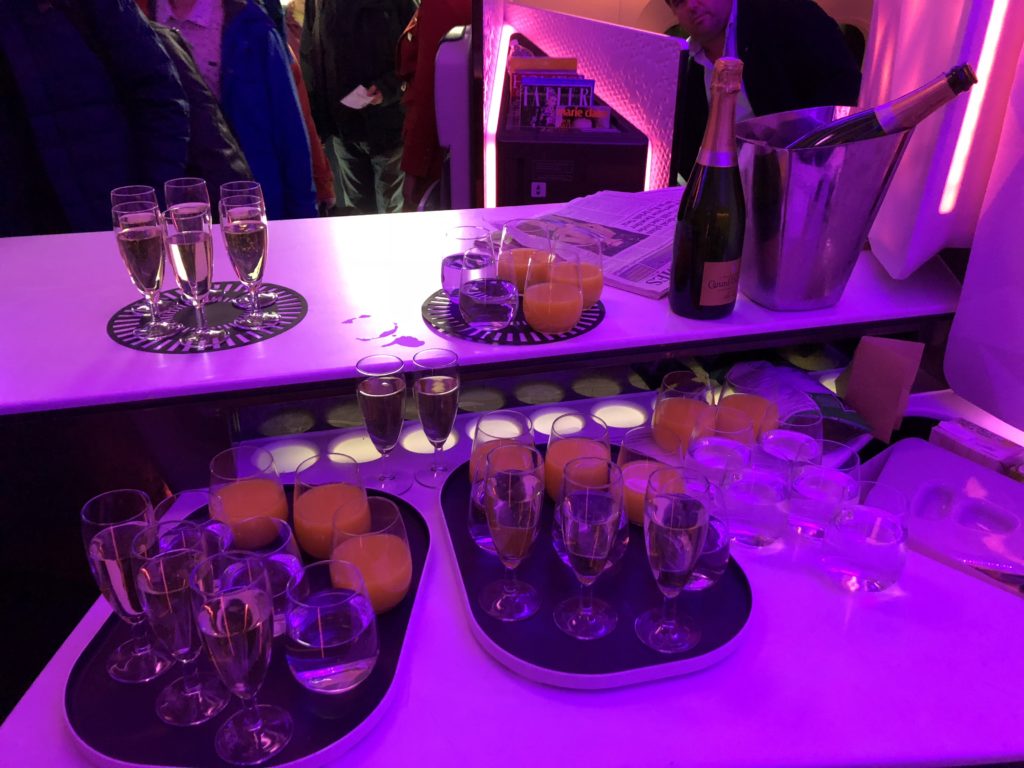 a table with glasses and champagne on it