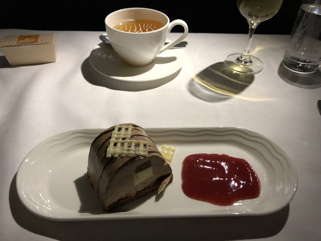 a plate of dessert and a cup of tea