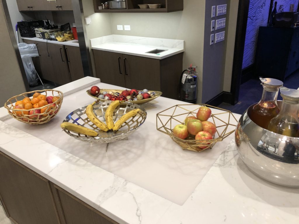 a kitchen counter with fruit and vegetables