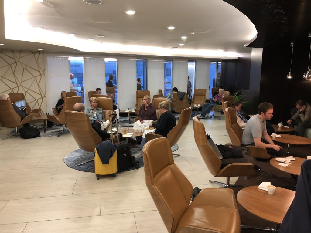 a group of people sitting in chairs in a room