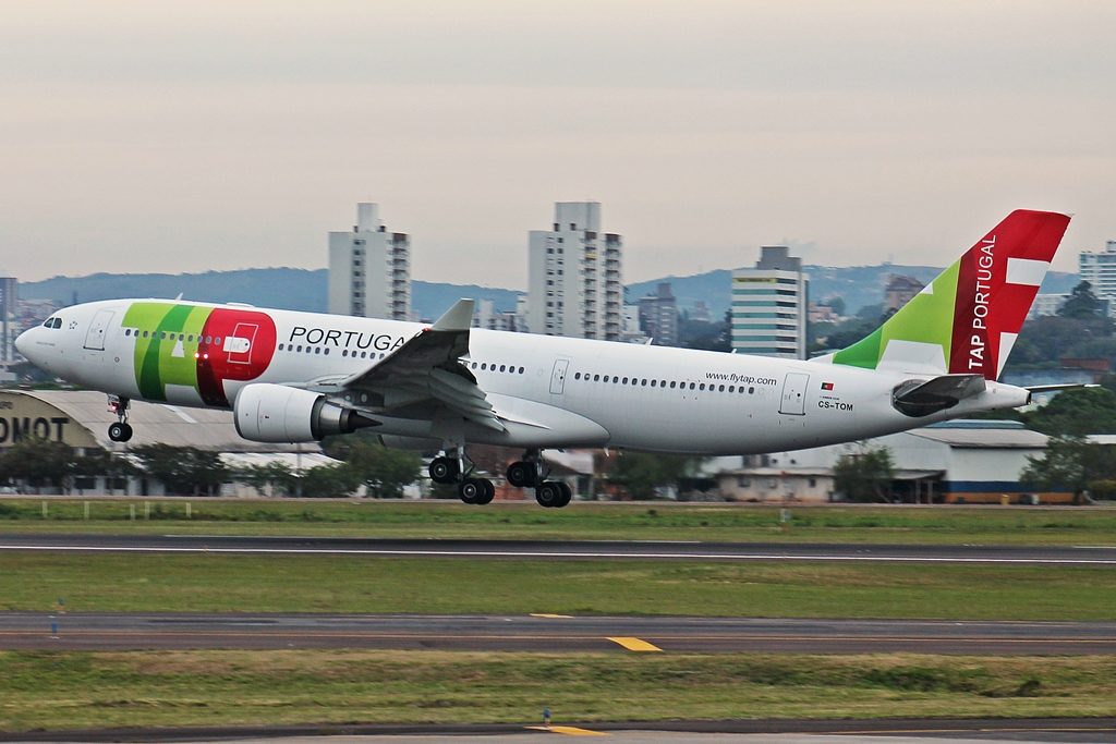 a white airplane taking off