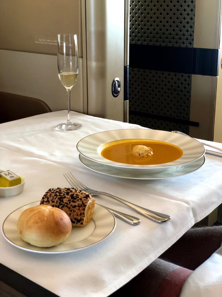 a plate of soup and bread on a table