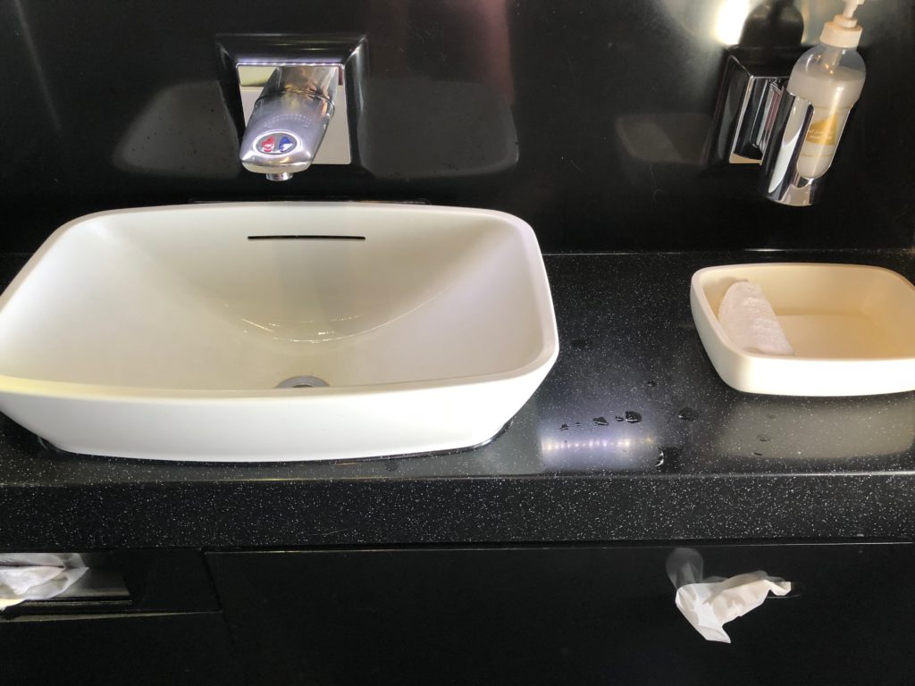 a sink and soap dish on a counter