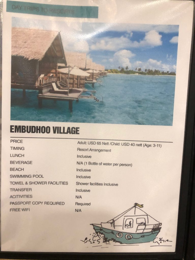 a sign with a picture of a hut and a beach