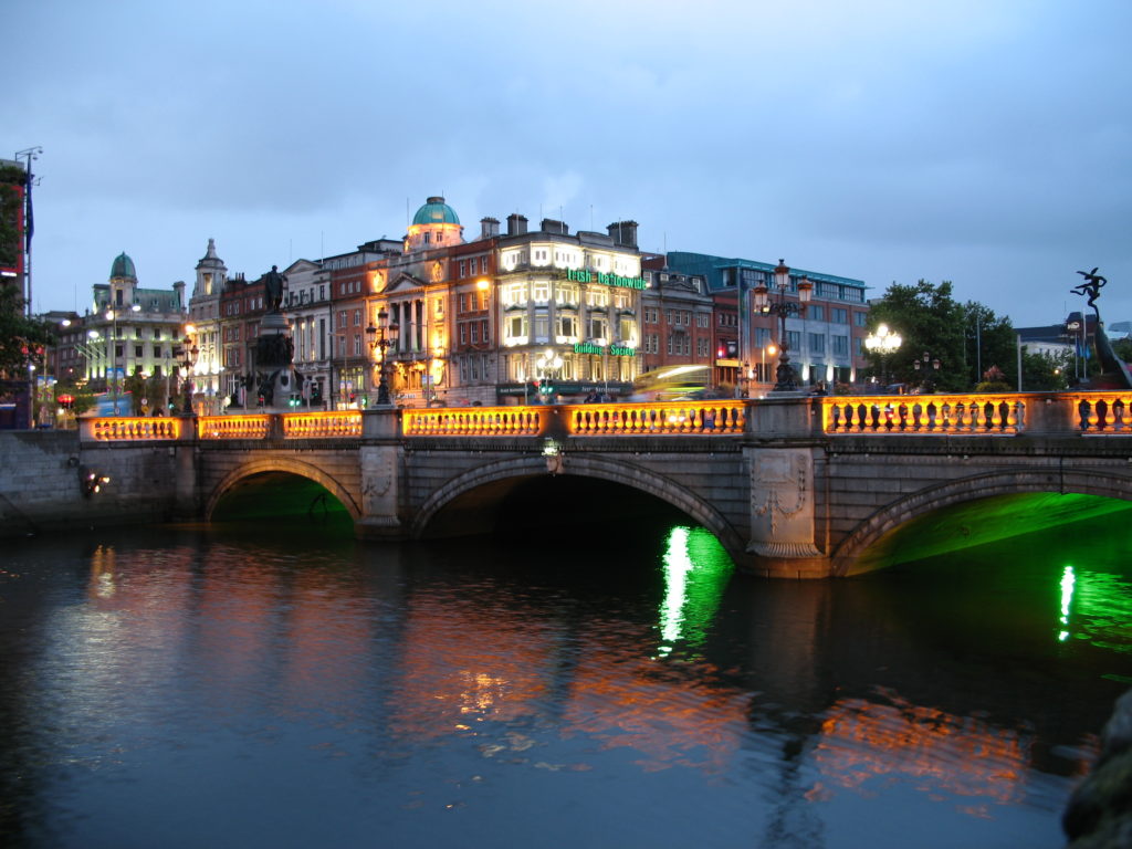 a bridge over a river with lights