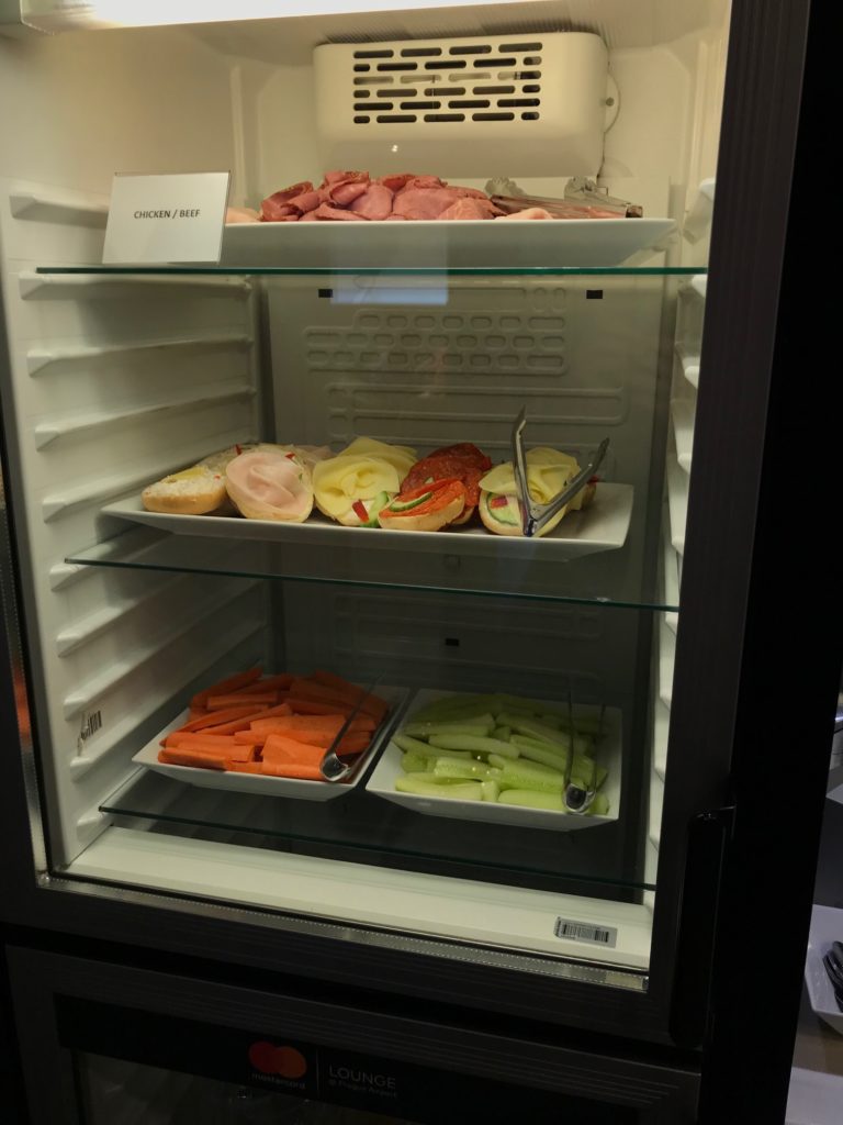 a refrigerator with food in it
