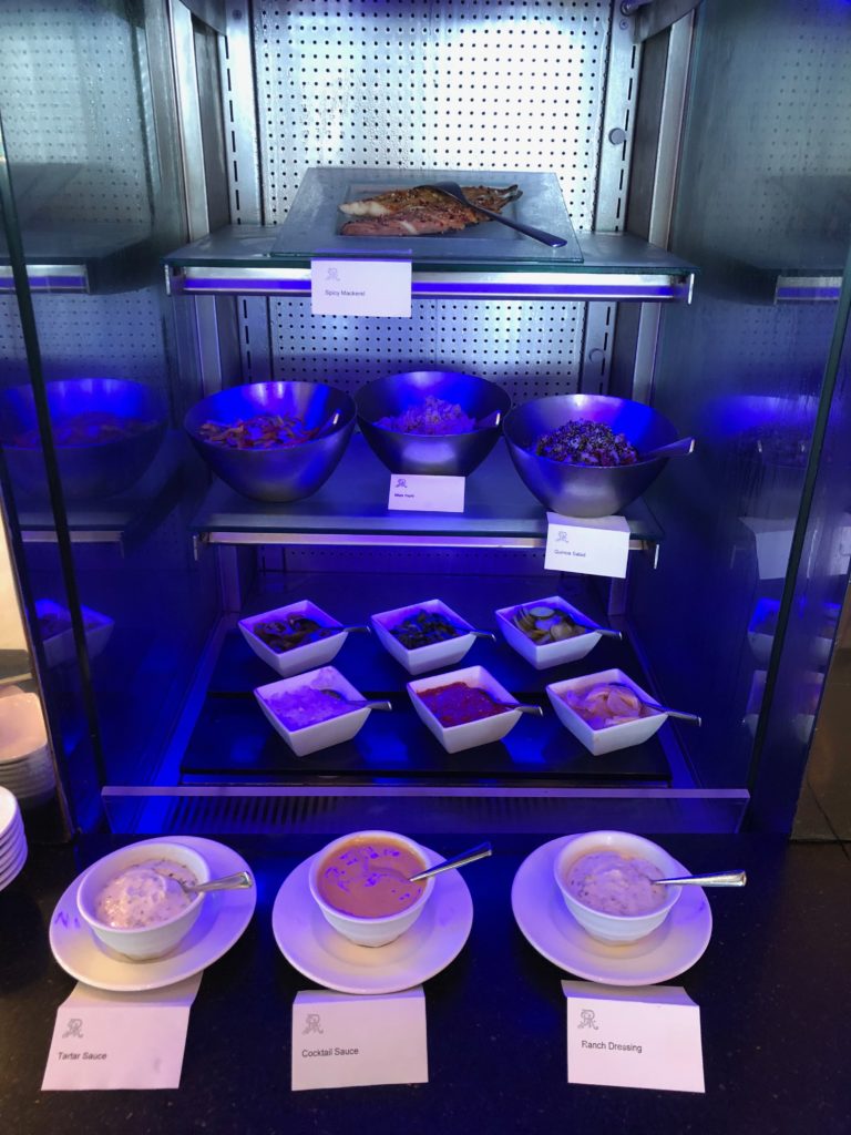 a display case with bowls of food on it