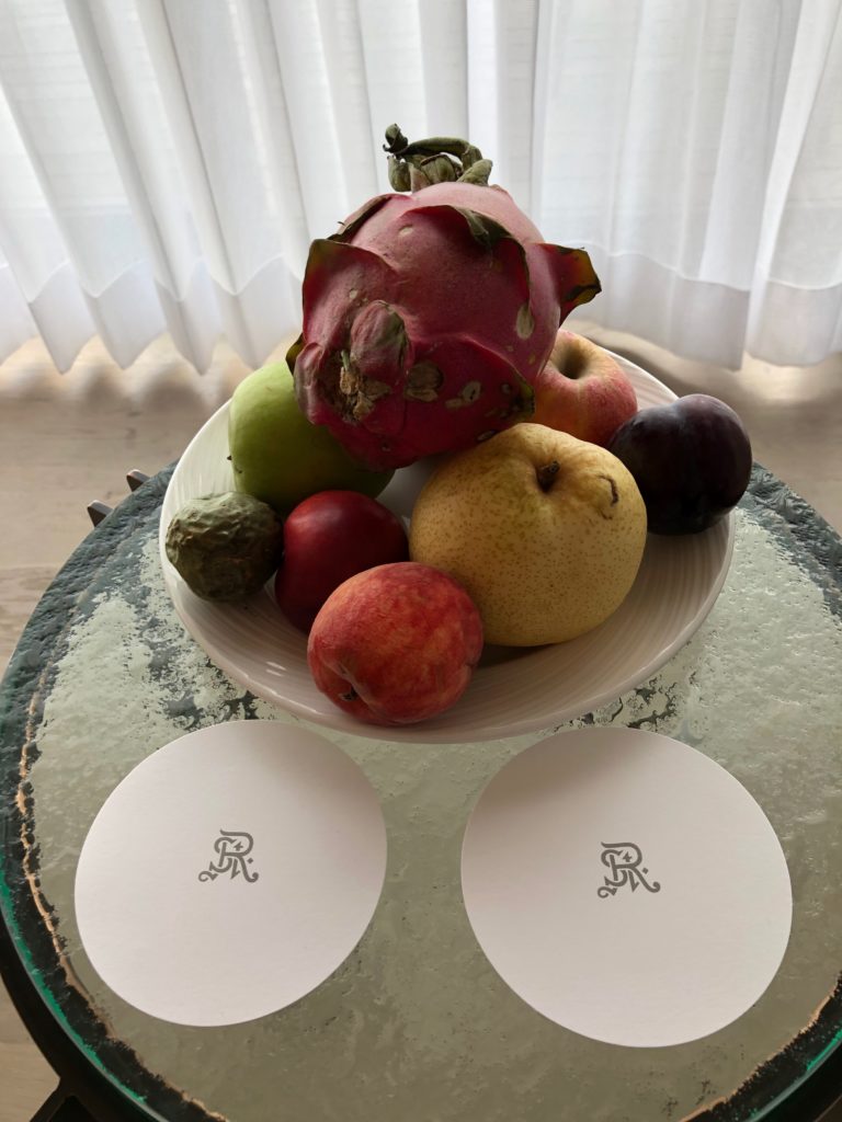 a bowl of fruit on a table