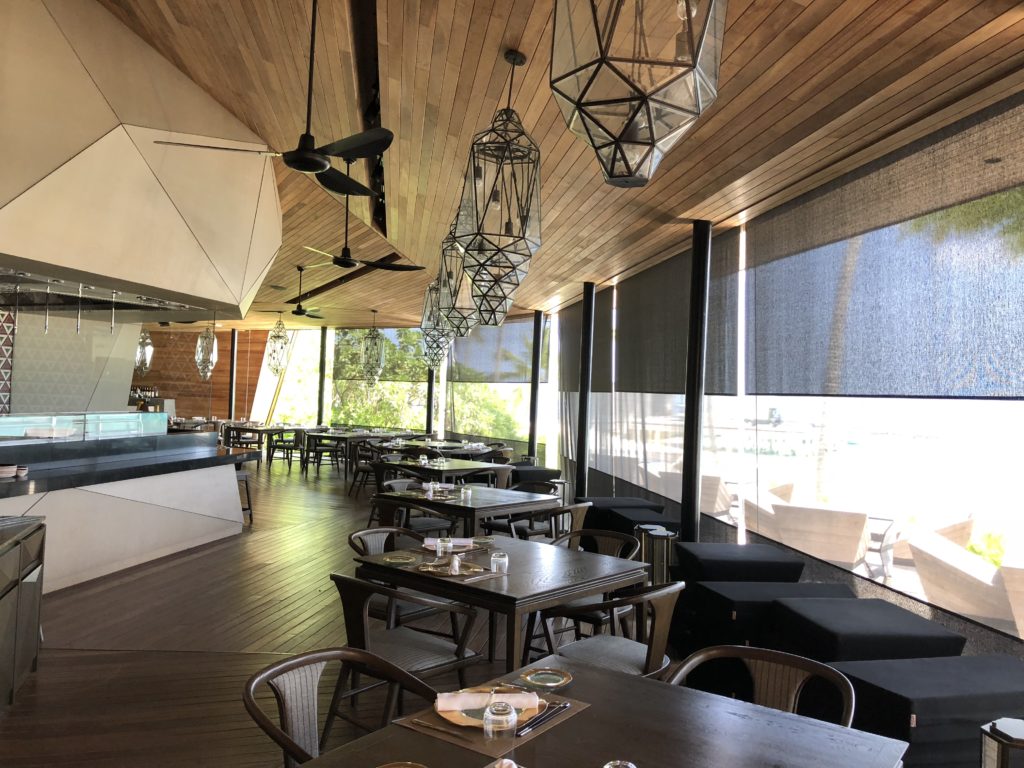 a restaurant with tables and chairs