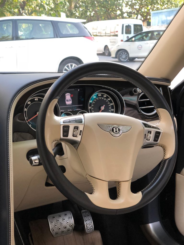 the steering wheel and dashboard of a car