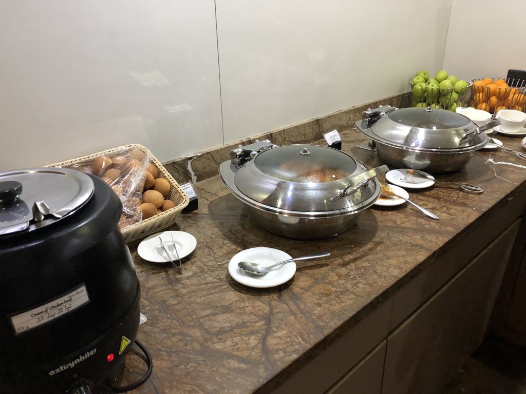 a group of silver pots on a counter