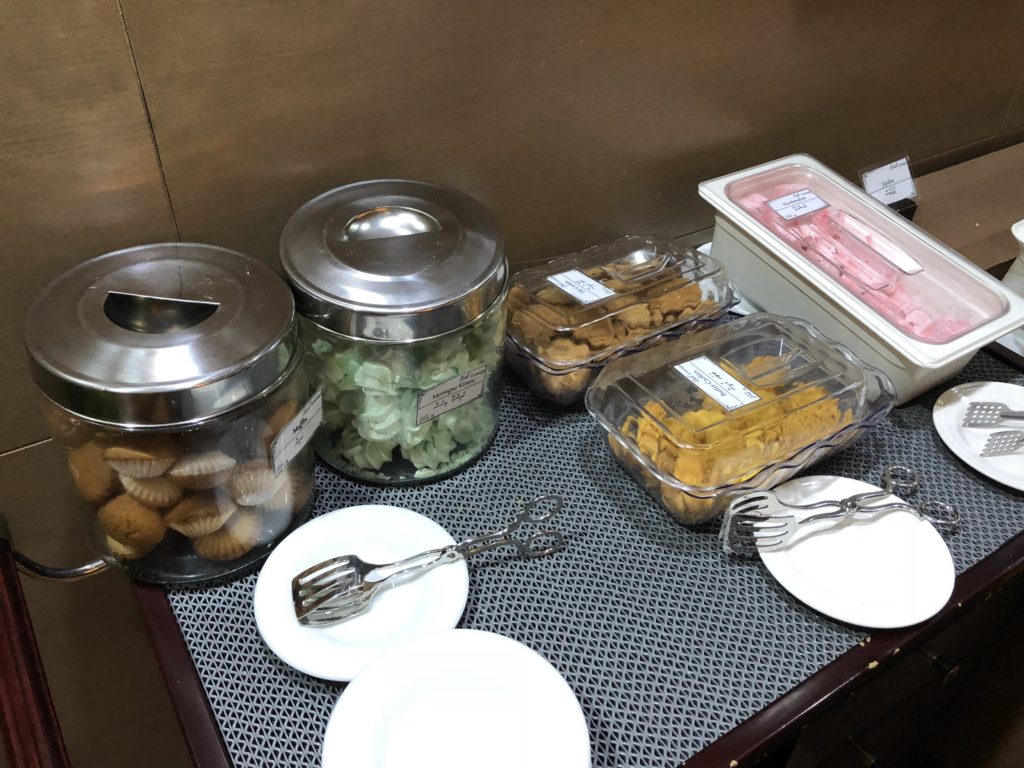 a table with food containers and plates