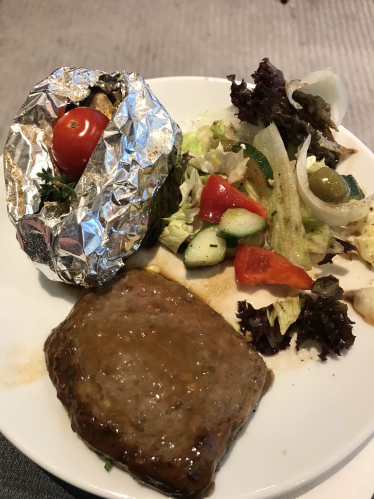 a plate of food with foil on it