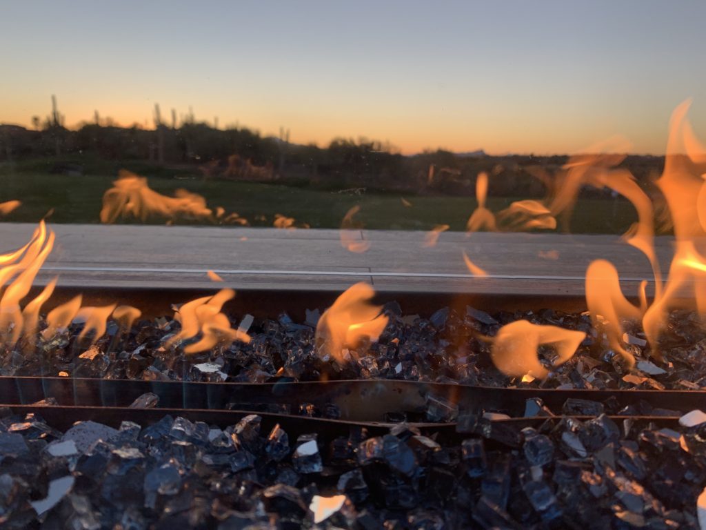 a fire burning in a fire pit