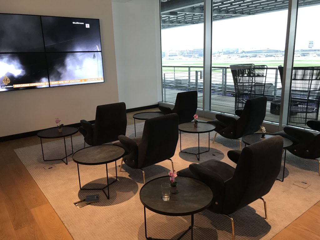 a room with black chairs and tables