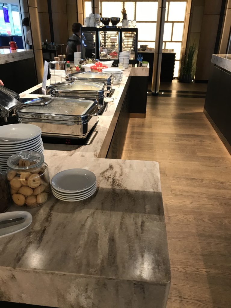 a buffet line with food on the counter