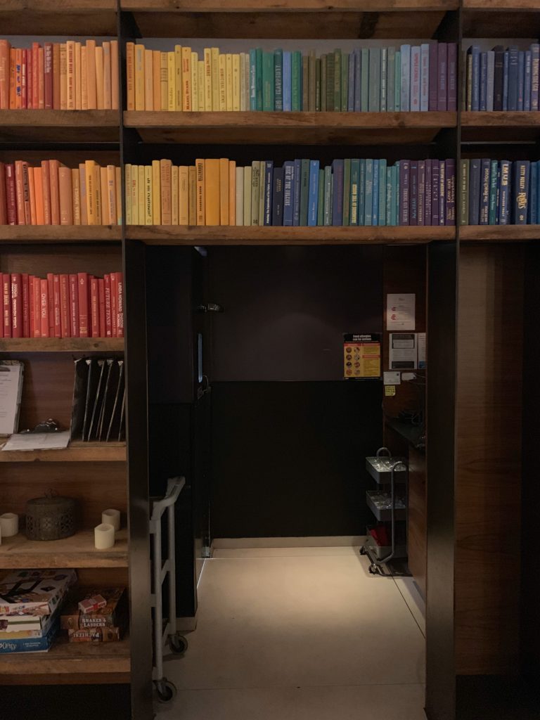 a book shelf with many books
