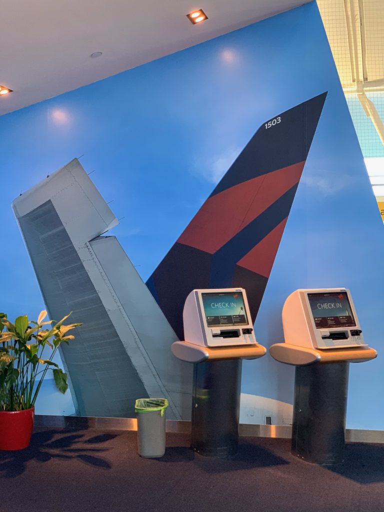 a group of electronic devices in front of a mural of an airplane