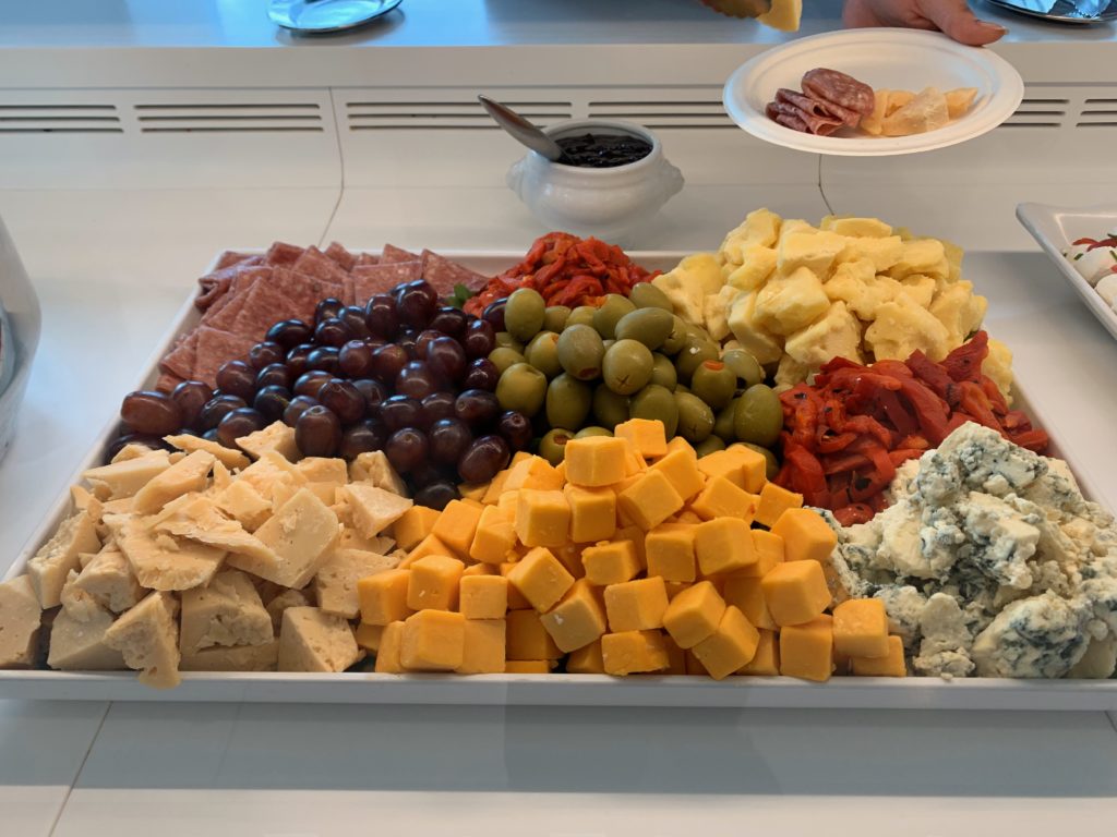 a tray of cheese and olives