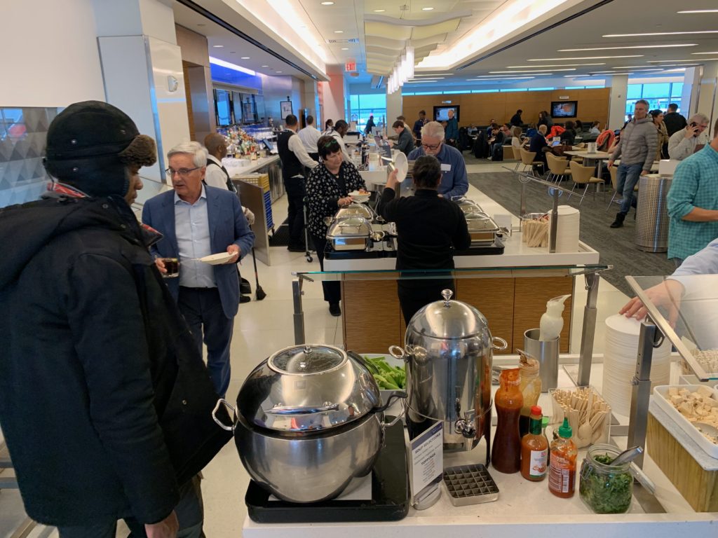 a group of people in a cafeteria