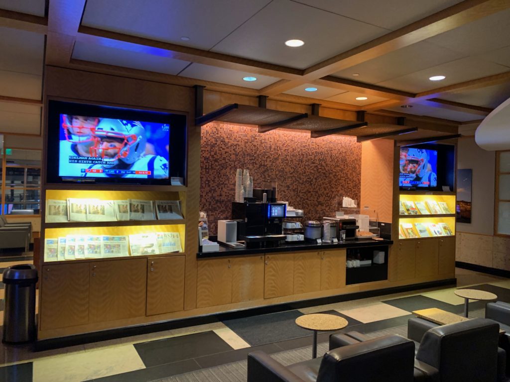 a room with a television and shelves