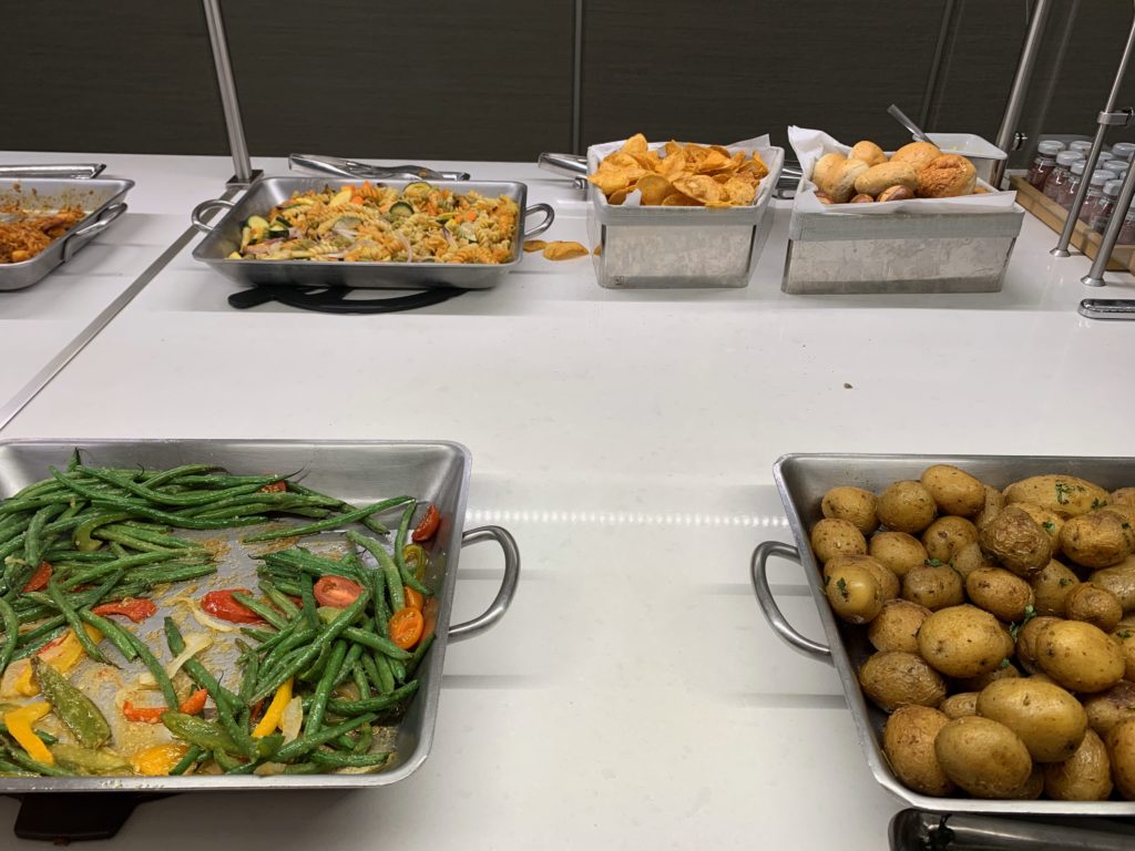 a group of metal pans with food in them